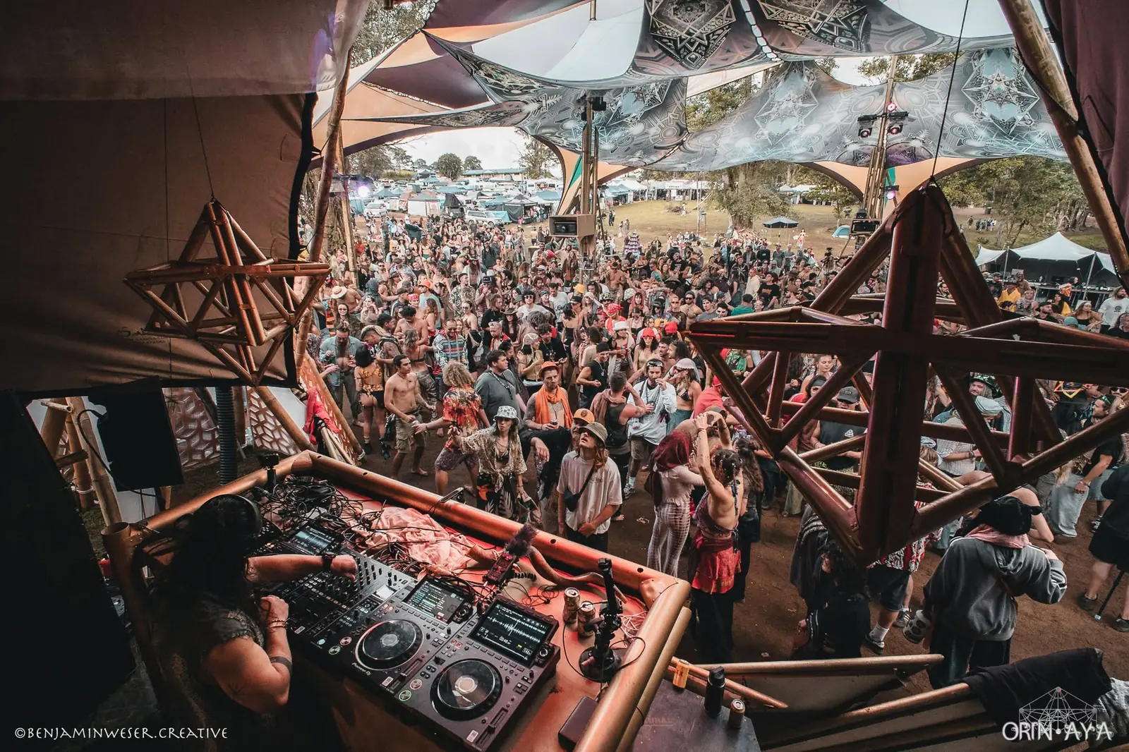 Pioneer decks in the DJ booth overlooking the crowd