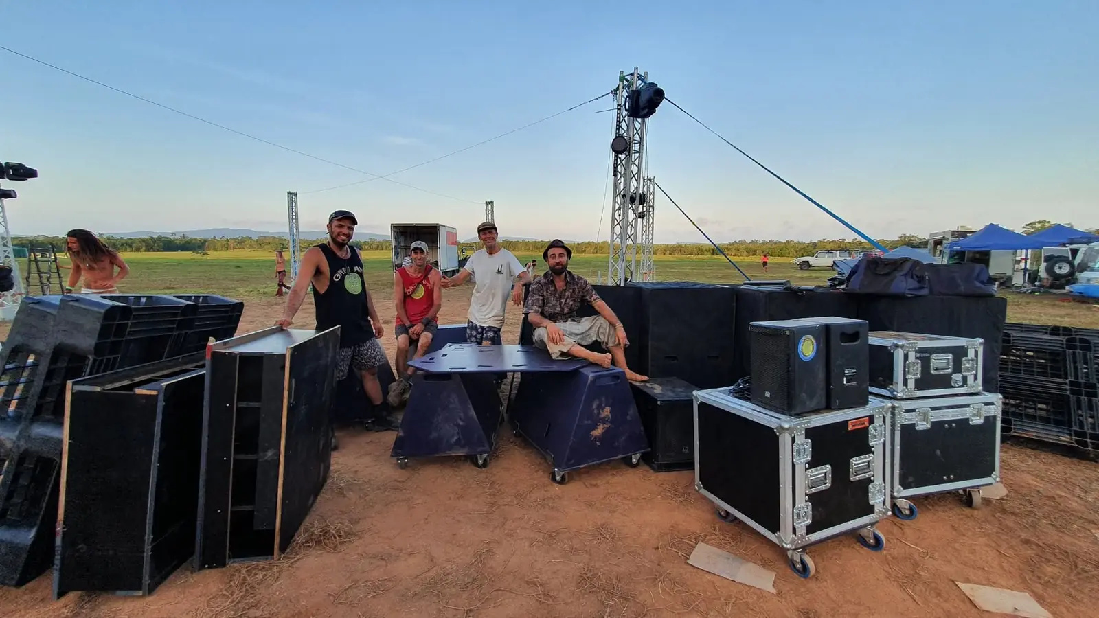 Crew with Funktion-One flight cases on a festival site
